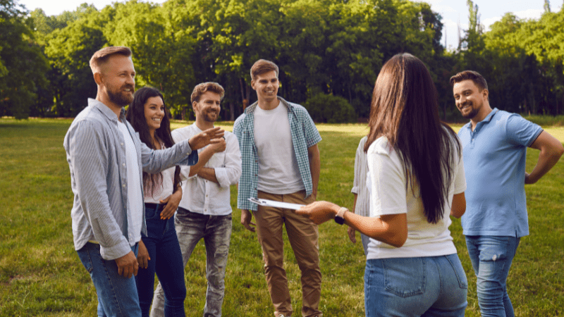 Group talking outside demonstrating a positive work culture