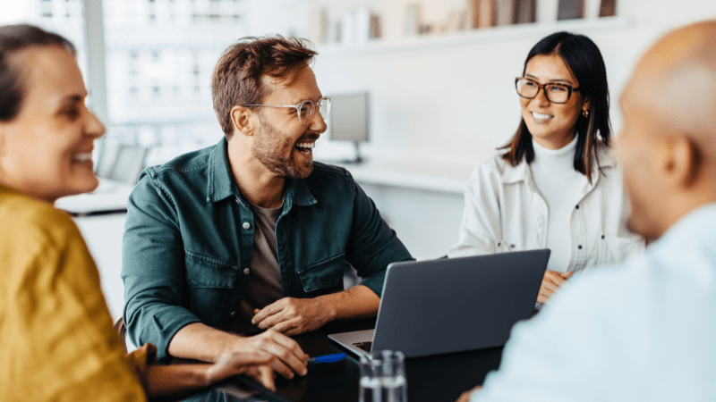 Happy, smiling team due to avoiding blame culture